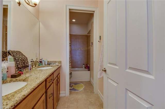 bathroom featuring shower / bath combo with shower curtain, vanity with extensive cabinet space, tile flooring, and double sink