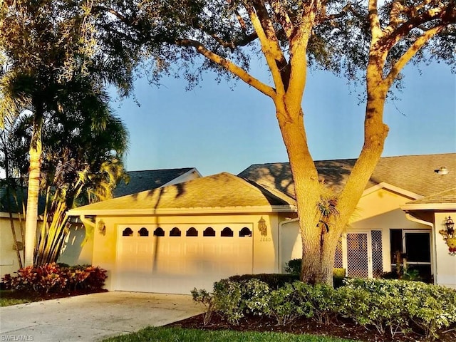 single story home featuring a garage