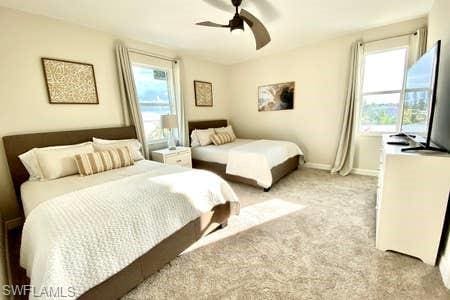 carpeted bedroom with ceiling fan