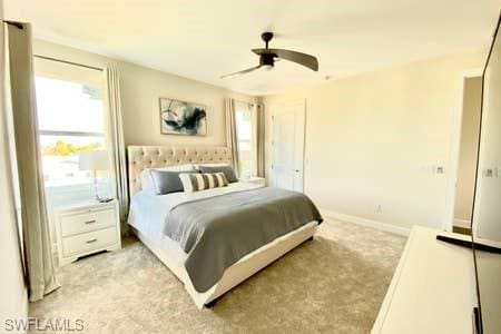 carpeted bedroom with ceiling fan