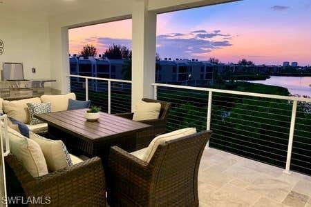 balcony at dusk with a water view