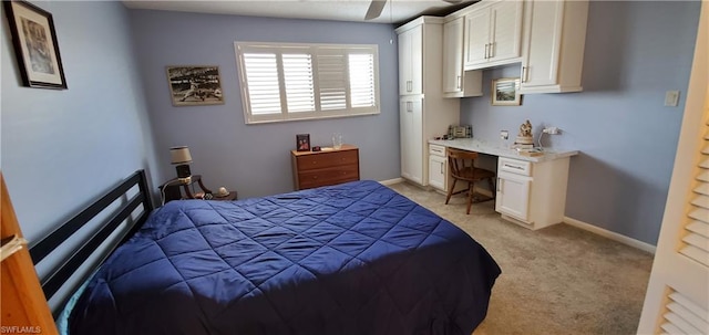 bedroom featuring light carpet and ceiling fan