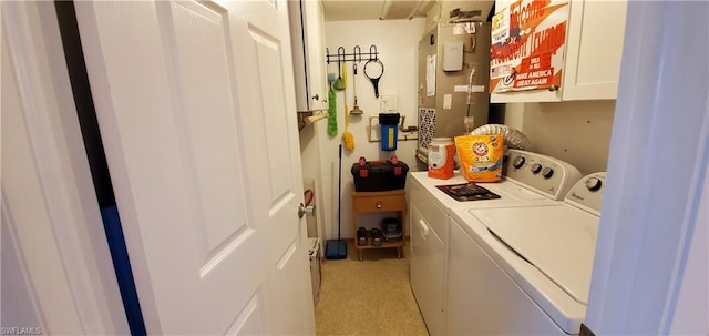 washroom featuring cabinets, separate washer and dryer, and heating utilities