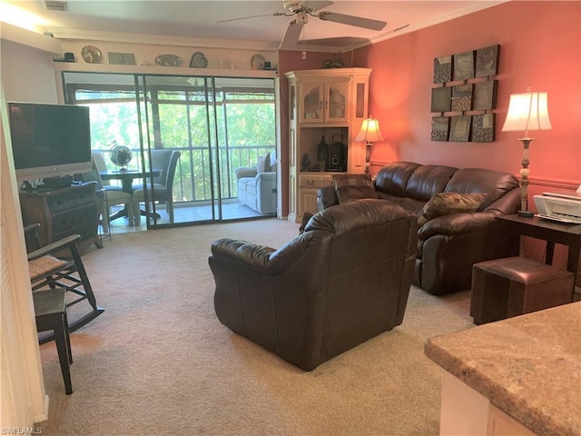 living room with light carpet, ceiling fan, and crown molding