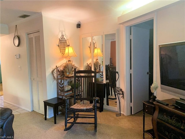 living area with light carpet and ornamental molding