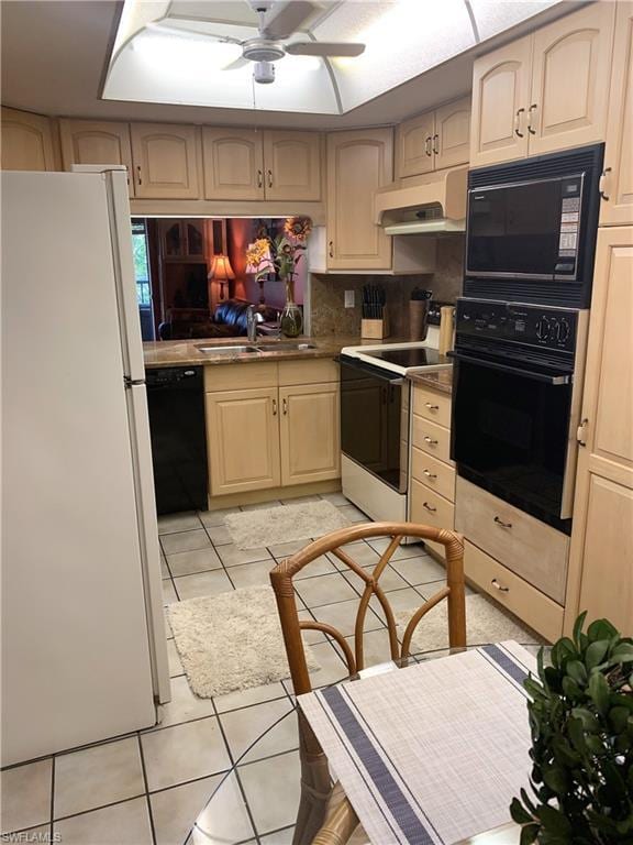 kitchen with custom exhaust hood, light tile flooring, ceiling fan, black appliances, and sink