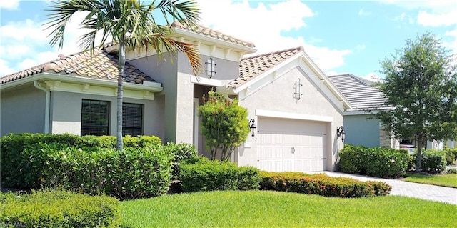 mediterranean / spanish-style home featuring a front yard