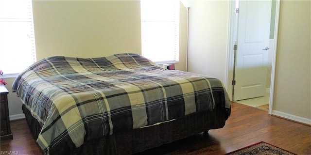 bedroom featuring dark wood-type flooring