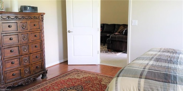 bedroom featuring dark hardwood / wood-style floors