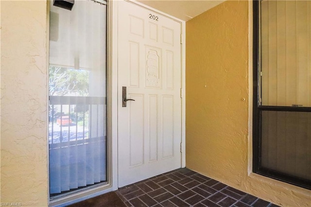 interior space featuring dark tile flooring