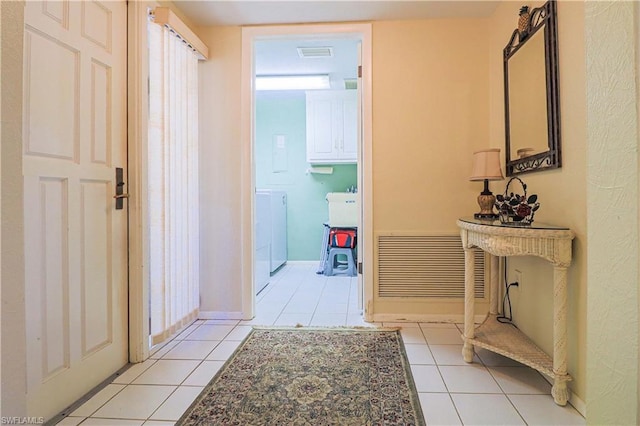 hallway featuring light tile floors