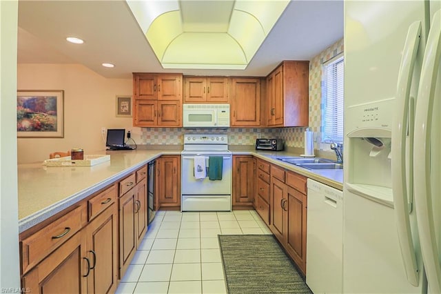 kitchen featuring backsplash, white appliances, sink, and light tile floors