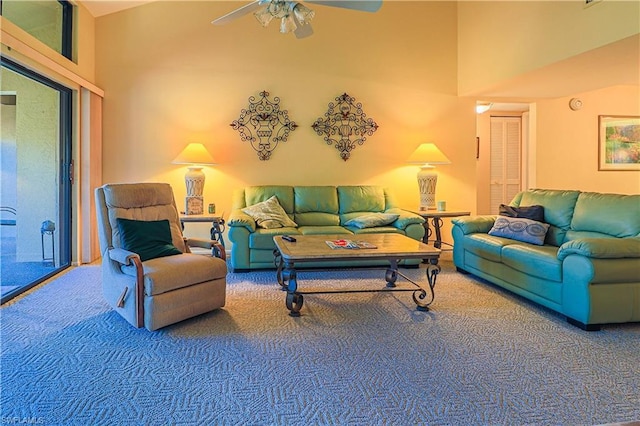 living room with carpet flooring, high vaulted ceiling, and ceiling fan