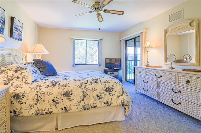 bedroom with access to outside, dark carpet, and ceiling fan