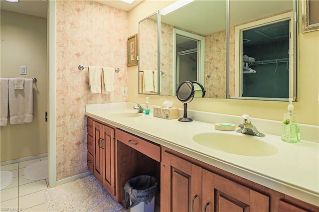 bathroom featuring dual vanity and tile flooring