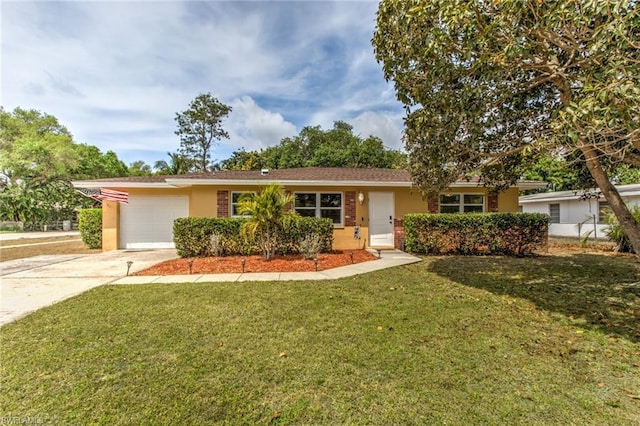 ranch-style house featuring a front lawn and a garage