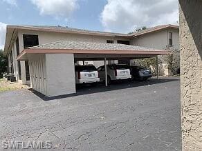 view of side of home with a carport