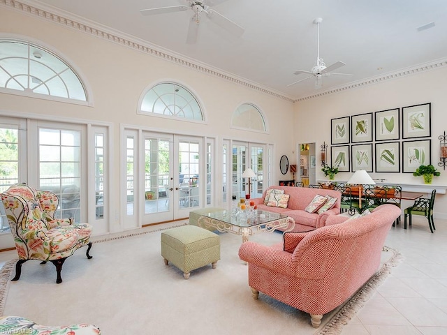 tiled living room with french doors, crown molding, and ceiling fan