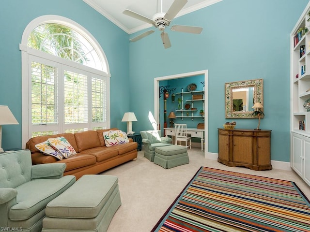 living room featuring ceiling fan, crown molding, built in features, light carpet, and high vaulted ceiling