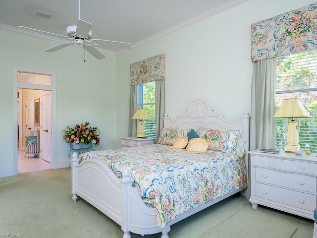 bedroom with light carpet, crown molding, and ceiling fan