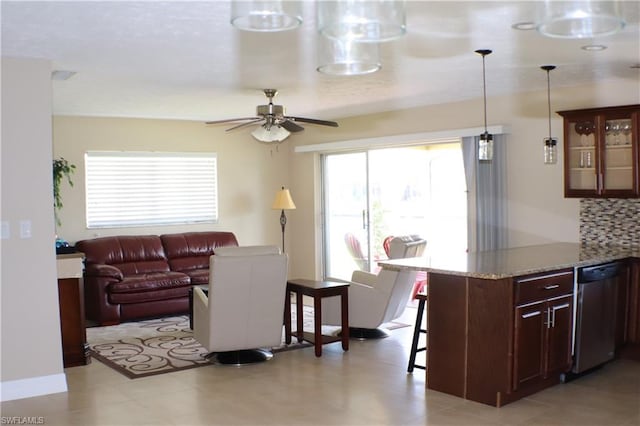 living room featuring ceiling fan and light tile floors