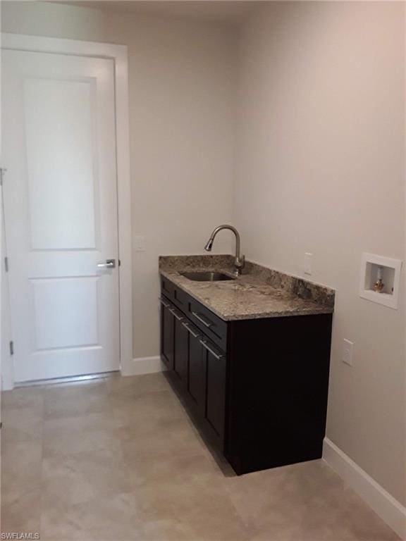 bathroom featuring tile floors and sink