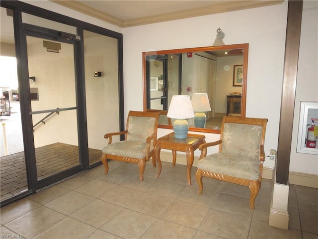 sitting room with light tile flooring and ornamental molding