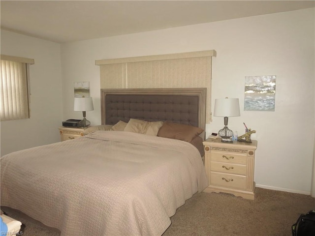 bedroom with dark carpet