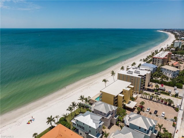 bird's eye view featuring a view of the beach and a water view