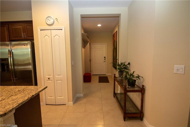 hallway with light tile floors