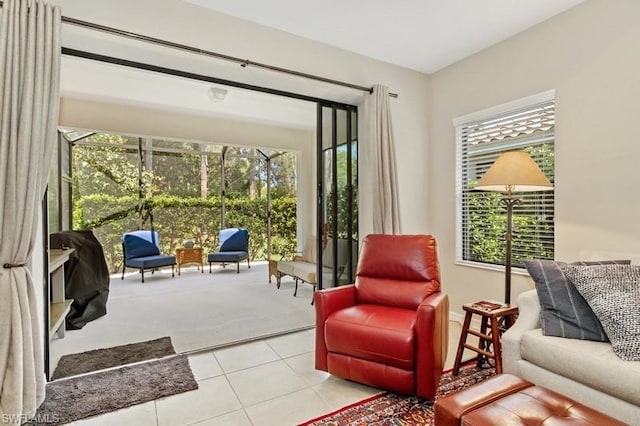 sitting room featuring plenty of natural light and light tile flooring