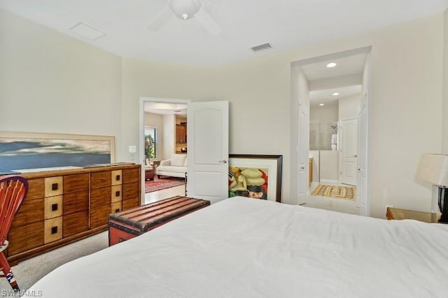 carpeted bedroom featuring connected bathroom and ceiling fan