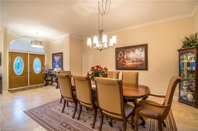 dining area with light tile floors, crown molding, and an inviting chandelier