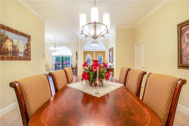 dining area featuring light tile floors, ornamental molding, and a chandelier