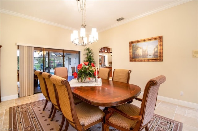 dining space featuring crown molding, light tile floors, and an inviting chandelier