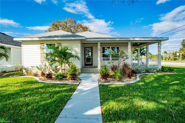 view of front of house with a front lawn and a porch