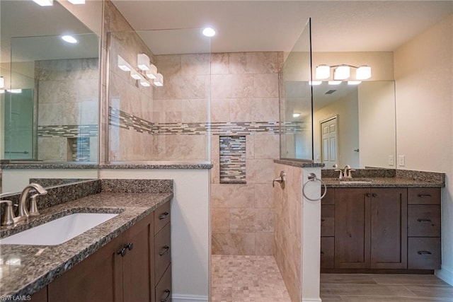 bathroom with large vanity and double sink