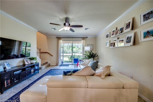 tiled living room with crown molding and ceiling fan