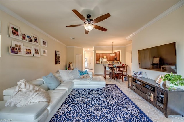 tiled living room featuring crown molding and ceiling fan