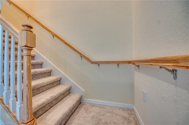 stairs with light colored carpet