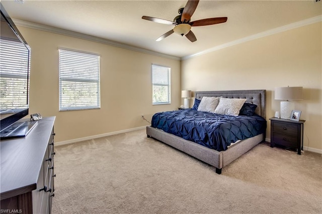 bedroom with ornamental molding, ceiling fan, and light colored carpet