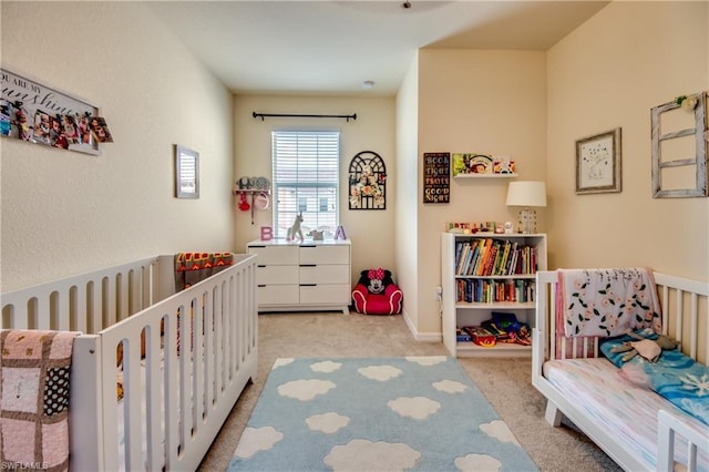 carpeted bedroom with a crib