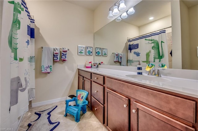 bathroom with vanity and tile flooring