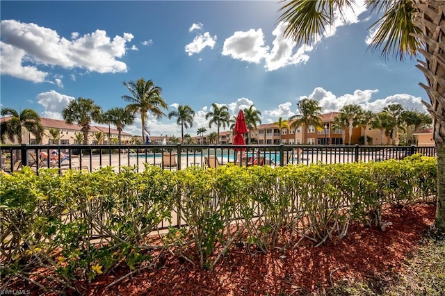 view of yard featuring a community pool