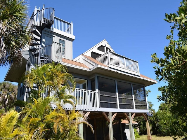 back of house with a balcony