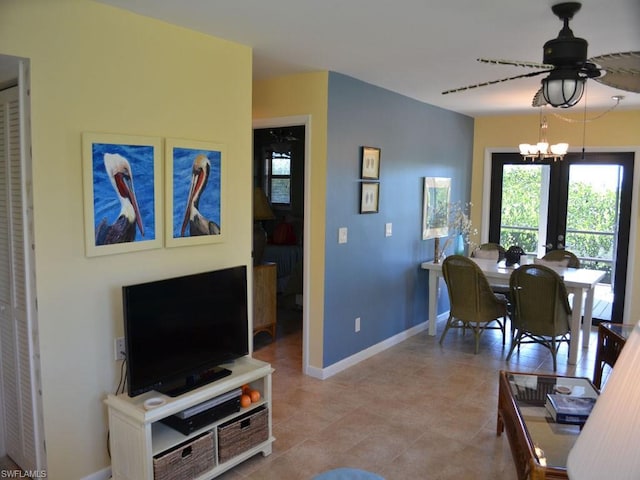 dining area with ceiling fan with notable chandelier and light tile flooring