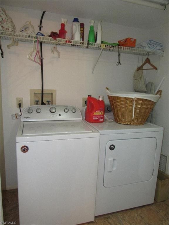 clothes washing area with hookup for a washing machine, electric dryer hookup, and independent washer and dryer