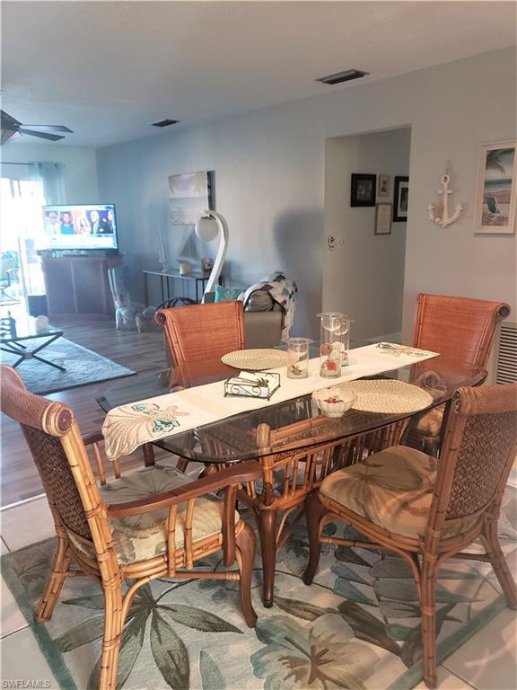 dining area featuring light hardwood / wood-style floors and ceiling fan