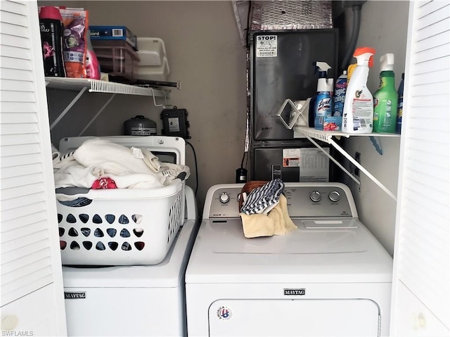 laundry area featuring washing machine and clothes dryer