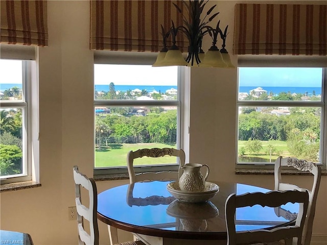 dining area featuring a water view